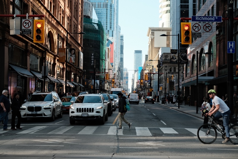 Cross walk and standing traffic in downtown Toronto.