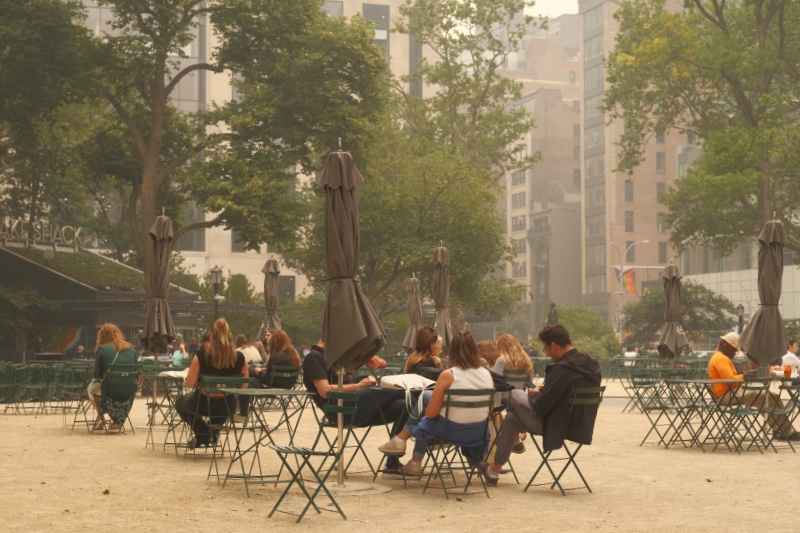 People sitting outside with terrible air quality, New York