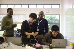 Watching developers participate in a hackathon in Kenya. © 2018 Amha Mogus